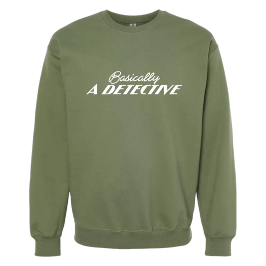 Olive green sweatshirt with white text reading ’Basically A DETECTIVE’ on the front.