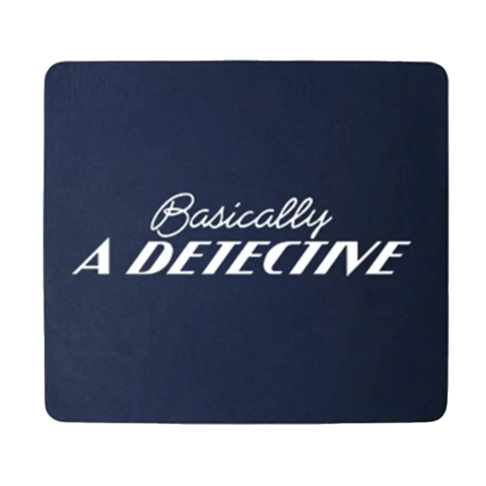 Navy blue mousepad with white text reading ’Basically A DETECTIVE’.