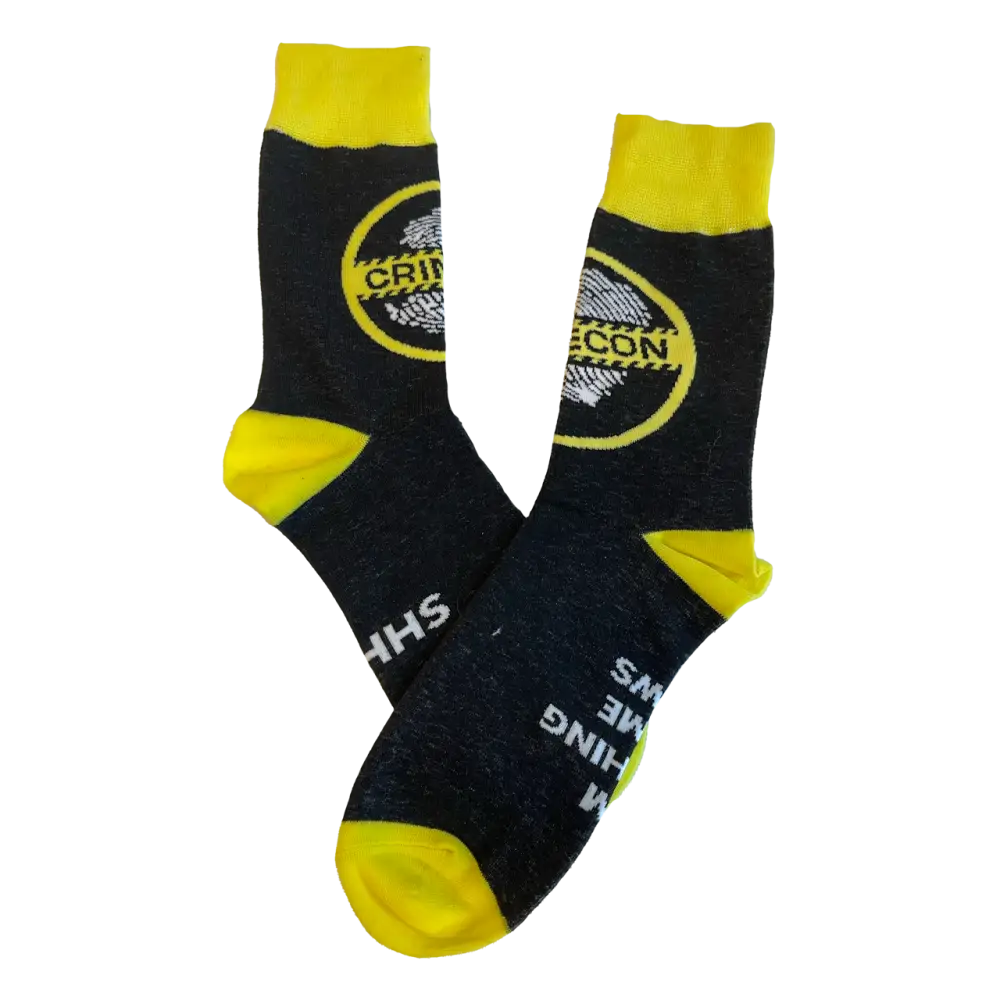 Pair of black and yellow socks with a circular logo design.