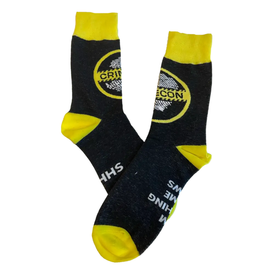 Pair of black and yellow socks with a circular logo design.