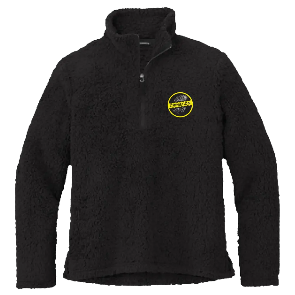 Black fleece jacket with a yellow circular logo on the chest.