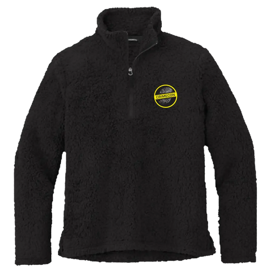 Black fleece jacket with a yellow circular logo on the chest.