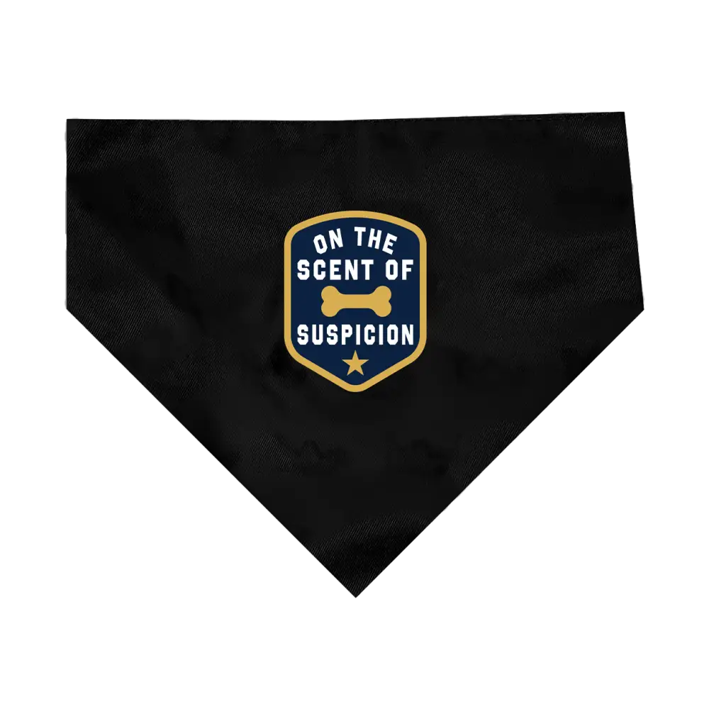 Black dog bandana with a humorous police-themed patch saying ’On the Scent of Suspicion’.