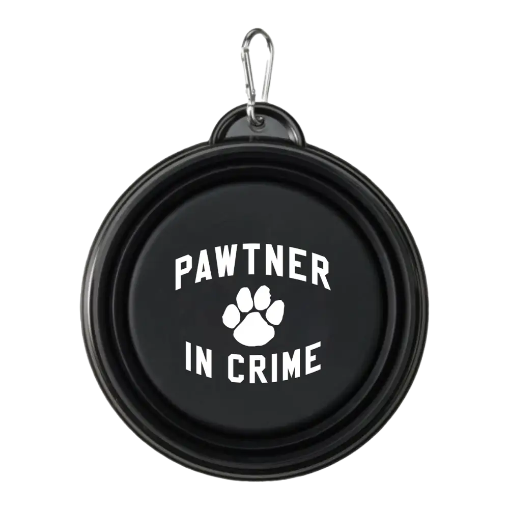 Collapsible black pet bowl with ’Pawtner in Crime’ and a paw print printed on it.