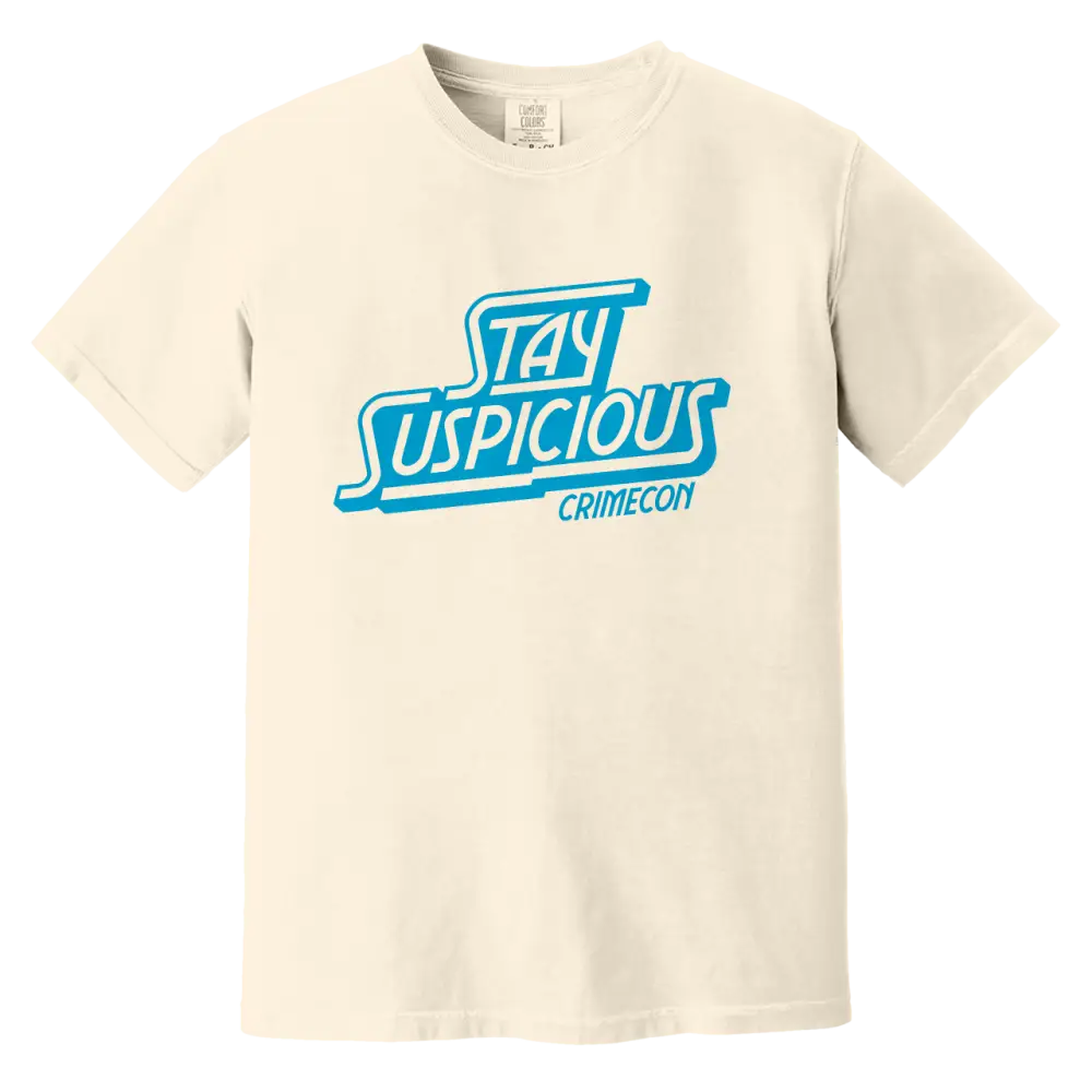 Cream-colored t-shirt with ’Stay Suspicious’ printed in blue lettering.