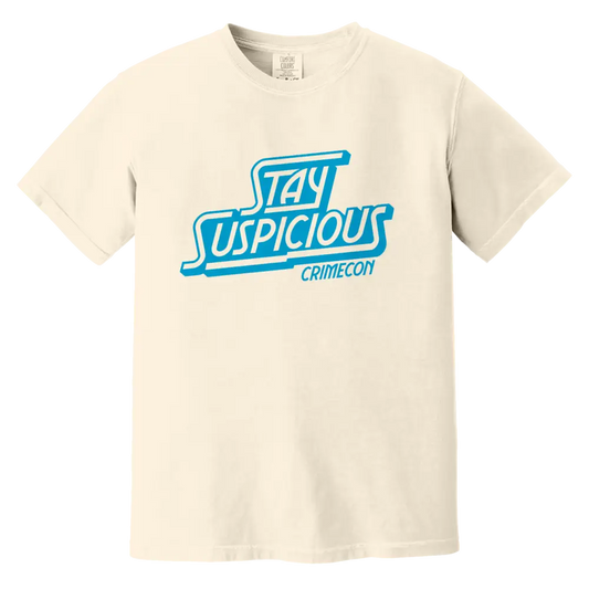 Cream-colored t-shirt with ’Stay Suspicious’ printed in blue lettering.